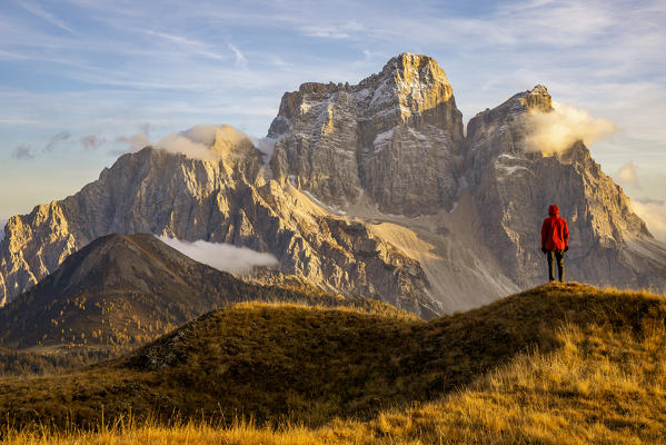 Italy,Veneto,Belluno district,Selva di Cadore,hiker admires the majesty of Monte Pelmo