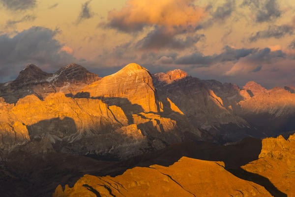 Italy,Veneto,Belluno district,aerial view of Tofana di Rozes and Fanis group lit by the warm sunset in autumn