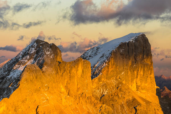 Italy, Trentino, district of Trento, aerial view of Piccolo Vernel and Punta Penia lit by the warm sunset in autumn