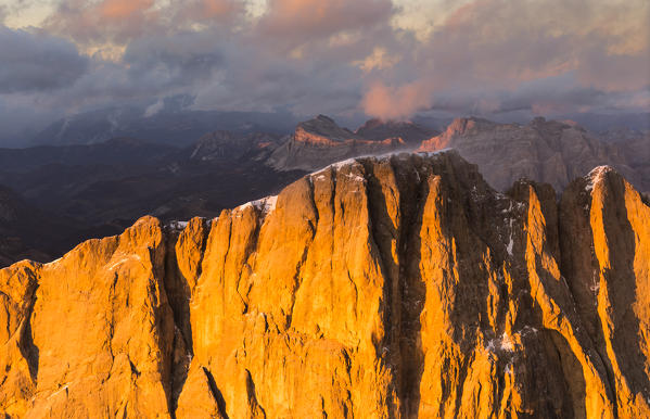 Italy, Trentino,Trento district,aerial view of Punta Penia and the south wall of Marmolada lit by the warm sunset in autumn