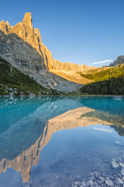 Italy,Veneto,Belluno district,Cortina d'Ampezzo,Sorapis group with Dito di Dio peak (God's finger) reflected in the Sorapis lake at sunrise