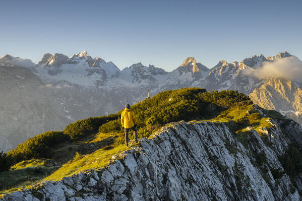 Italy,Veneto,province of Belluno,Auronzo di Cadore,hiker admires the north walls of Marmarole group early in the morning (MR)