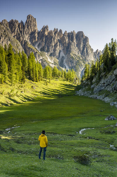 Italy, Veneto, Belluno province, Auronzo di Cadore, hiker admires Cadini di Misurina in the early morning (MR)