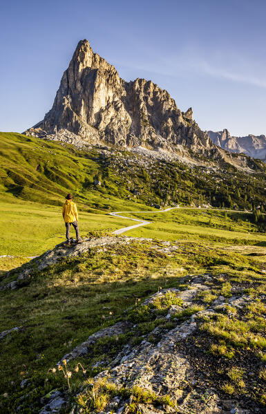 Italy, Veneto, province of Belluno, hiker admires mount La Gusela at Giau pass (MR)