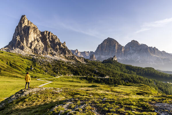 Italy, Veneto, province of Belluno, hiker admires mount La Gusela and Tofane group at Giau pass (MR)