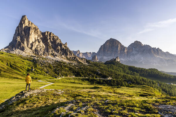 Italy, Veneto, province of Belluno, hiker admires mount La Gusela and Tofane group at Giau pass (MR)