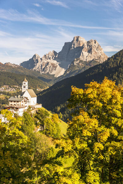 Italy, Veneto, province of Belluno,the iconic church of Colle Santa Lucia with mount Pelmo in the background