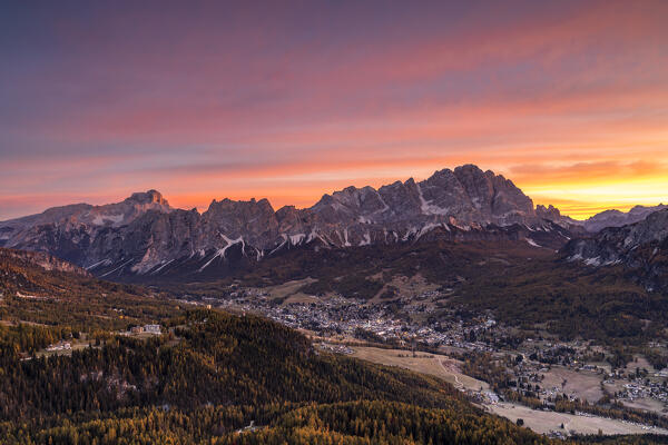 The tourist resort of Cortina d'Ampezzo with the Cristallo, Pomagagnon and Croda Rossa in the background at dawn, Belluno province, Boite Valley, Veneto, Italy