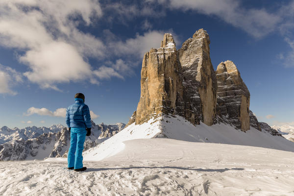 Man looks at the Three peaks from Lavaredo pass,Bolzano district, South Tyrol,Italy,Europe