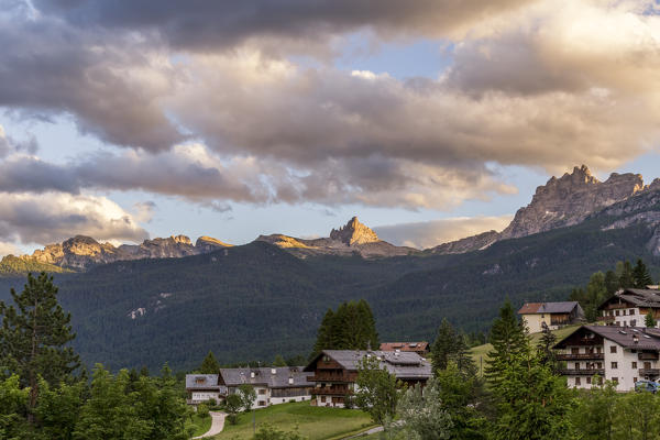 Homes in Cortina d'Ampezzo and in the background the group of Rocchette and mount Croda da Lago, Belluno district,Veneto,Italy,Europe