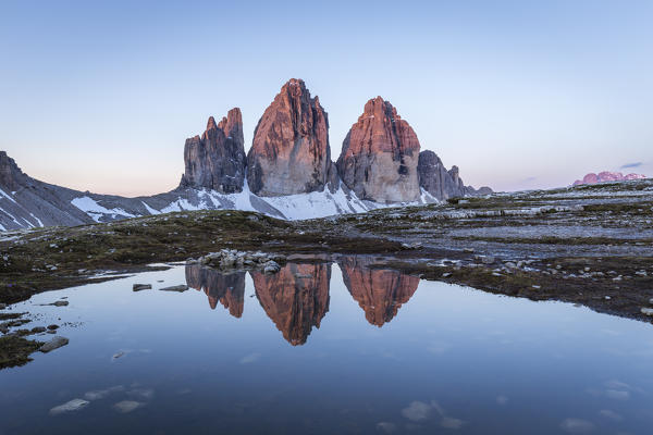 Sunrise of the Three Peaks reflected in a puddle, Natural Park Three Peaks,Sesto Pusteria,Bolzano district, South Tyrol,Italy,Europe