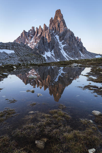 Sunrise of Mount Paterno reflected in a puddle, Natural Park Three Peaks,Sesto Pusteria,Bolzano district, South Tyrol,Italy,Europe
