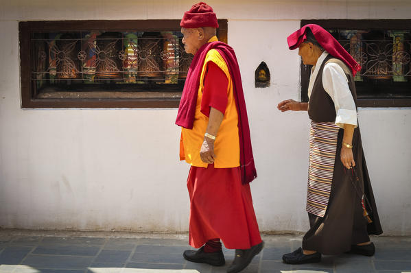 Buddhist Pilgrims walking  around the stupa of Bouddhanath,Kathmandu,Nepal,Asia
