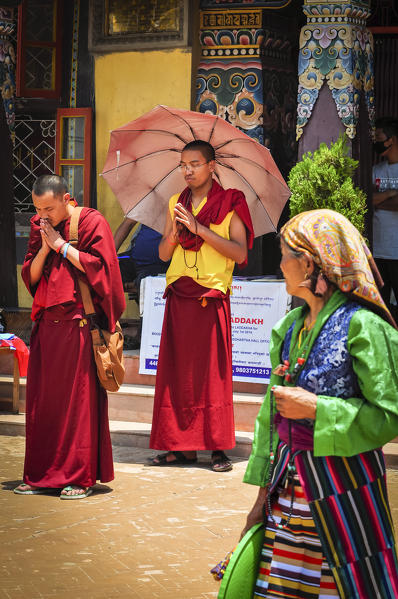 Buddhist monks praying at the Bouddhanath stupa,Kathmandu, Nepal,Asia