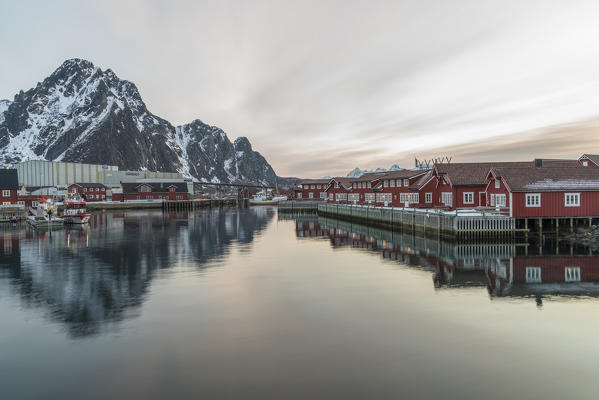 Traditional red houses at sunset in winter. Svolvaer, Nordland county, Northern Norway region, Norway.