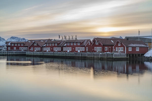 Traditional red houses at sunset in winter. Svolvaer, Nordland county, Northern Norway region, Norway.
