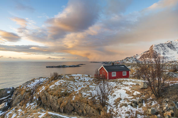 Traditional fishermen house in winter at dawn. Hamnoy, Nordland county, Northern Norway, Norway.