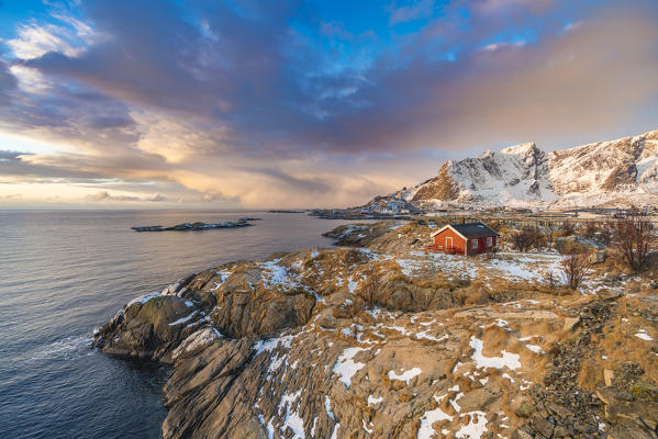Traditional fishermen house in winter at dawn. Hamnoy, Nordland county, Northern Norway, Norway.