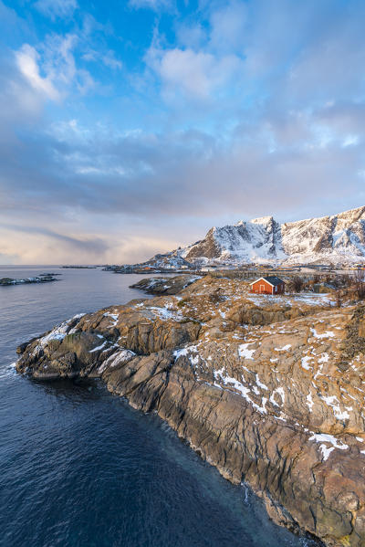 Traditional fishermen house in winter at dawn. Hamnoy, Nordland county, Northern Norway, Norway.