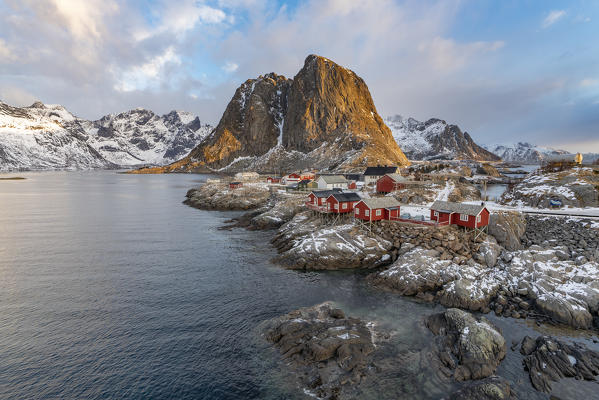 The fishing village with its traditional 'rorbus' at dawn in winter. Hamnoy, Nordland county, Northern Norway, Norway.