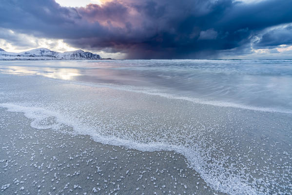 Skagsanden beach after a hailstorm at sunset, Flakstad, Nordland county, Northern Norway, Norway.