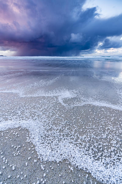 Skagsanden beach after a hailstorm at sunset, Flakstad, Nordland county, Northern Norway, Norway.