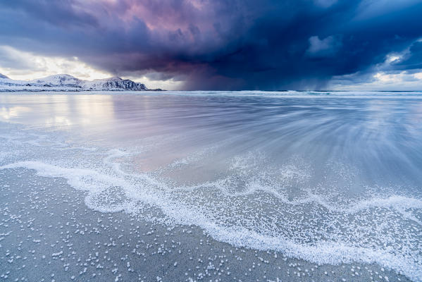 Skagsanden beach after a hailstorm at sunset, Flakstad, Nordland county, Northern Norway, Norway.