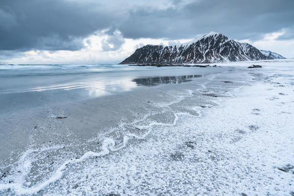 Skagsanden beach after a hailstorm at sunset, Flakstad, Nordland county, Northern Norway, Norway.