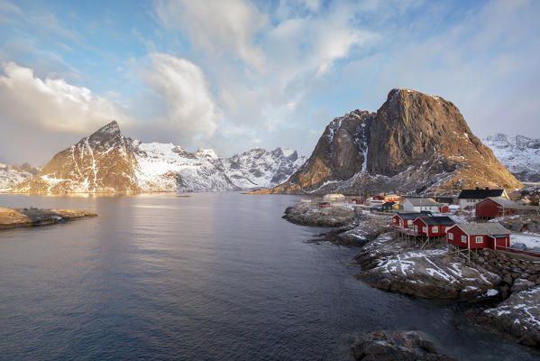 The fishing village with its traditional 'rorbus' in the winter morning light. Hamnoy, Nordland county, Northern Norway, Norway.