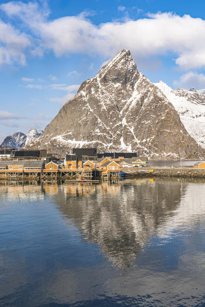 Olstinden peak reflecting on the sea at Sariskoy. Reine, Lofoten district, Nordland county, Northern Norway, Norway.