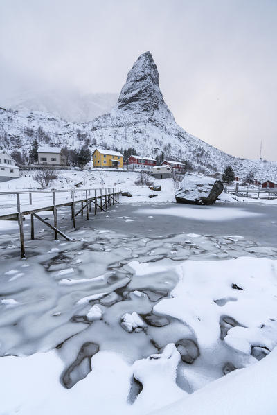 Bridge on the fjord with Hammarskaftet peak in the background. Reine, Nordland county, Northern Norway, Norway.