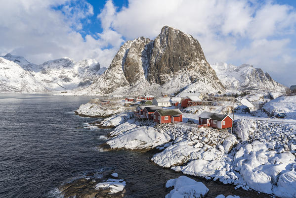 Hamnoy village covered in snow, with Festheltinden peak in the background. Moskenes municipality, Nordland county, Northern Norway, Norway.