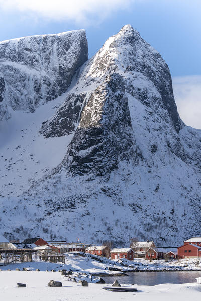 Close-up on Navaren peak and the village of Reine in winter. Lofoten district, Nordland county, Northern Norway, Norway.