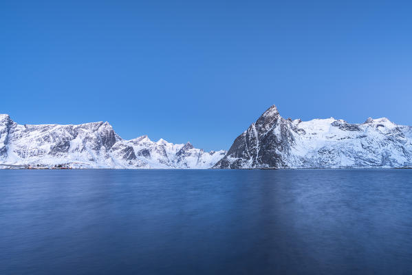 Olstinden peak at dusk in winter, shot from Hamnoy. Reine, Nordland county, Northern Norway, Norway.
