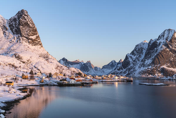 Reine fjord and Navaren peak in the morning light in winter. Reine, Nordland county, Northern Norway, Norway.