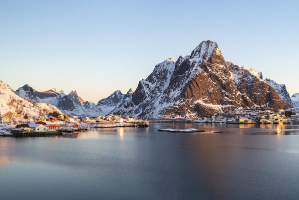 Reine fjord and Olstinden peak in the morning light in winter. Reine, Nordland county, Northern Norway, Norway.