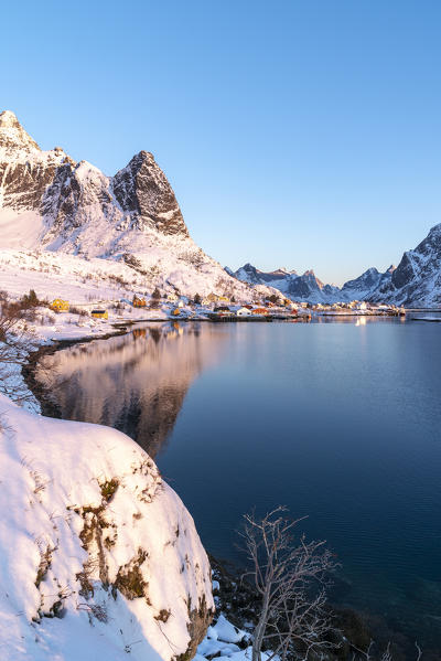 Reine fjord and Navaren peak in the morning light in winter. Reine, Nordland county, Northern Norway, Norway.