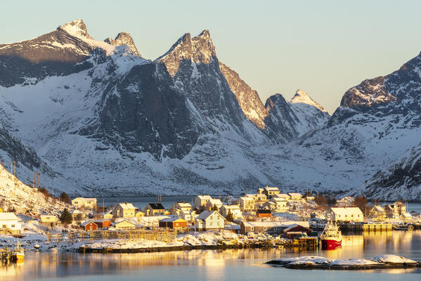 Reine fjord and its harbour in the winter morning light. Reine, Nordland county, Northern Norway, Norway.