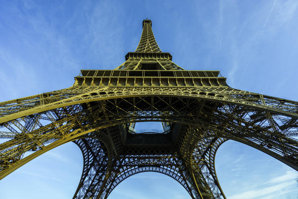 Perspective of the Eiffel Tower looking upward toward its top spire, Paris, France