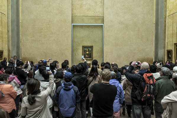 Tourists photographing Mona Lisa, The Louvre, Paris, France