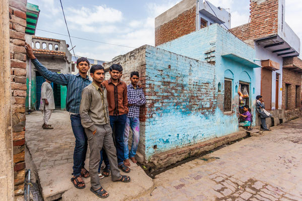 Asia, India, Uttar Pradesh, Nandgaon, local boys posing for the picture