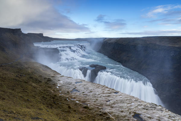 Landscape with waterfall and steam. Gullfoss, Southwest Iceland, Europe.