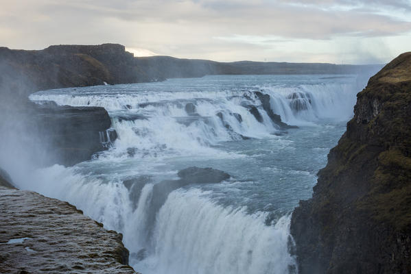 Landscape with waterfall and steam. Gullfoss, Southwest Iceland, Europe.