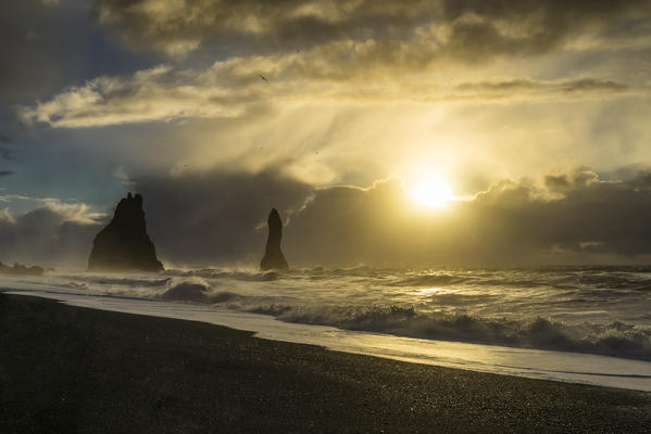 The sun is rising at the beach of Reynisfjara, Vik, Sudurland, Iceland, Europe