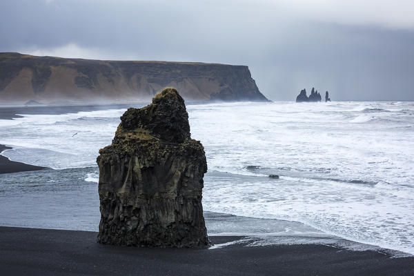 Solitary rock on the beach of Reynisfjara, Vik, Sudurland, Iceland, Europe