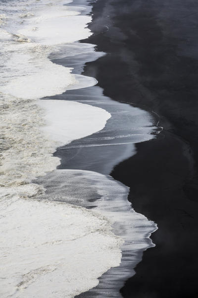 Detail of the ocean and the long black sand beach of Reynisfjara, Vik, Sudurland, Iceland, Europe