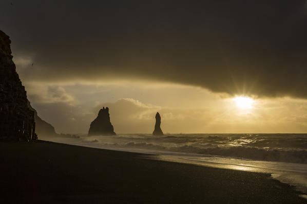 The sun is rising at the beach of Reynisfjara, Vik, Sudurland, Iceland, Europe