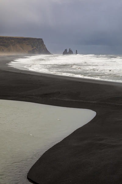 Graphic lines formed by the waves of the ocean on the beach of Reynisfjara, Vik, Sudurland, Iceland, Europe