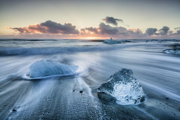 Blocks of ice on the black beach in Jokulsarlon Glacier Lagoon, Eastern Iceland, Europe