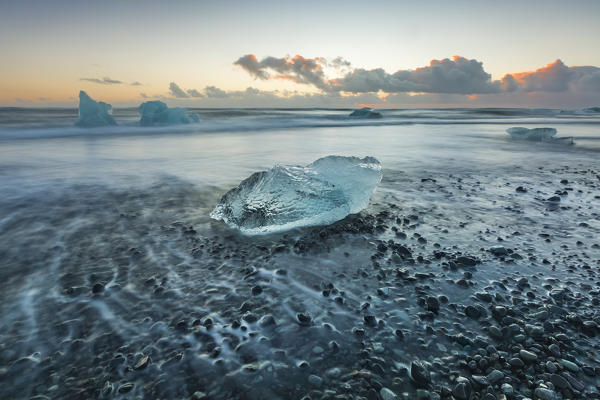 Block of ice on the black beach in Jokulsarlon Glacier Lagoon, Eastern Iceland, Europe